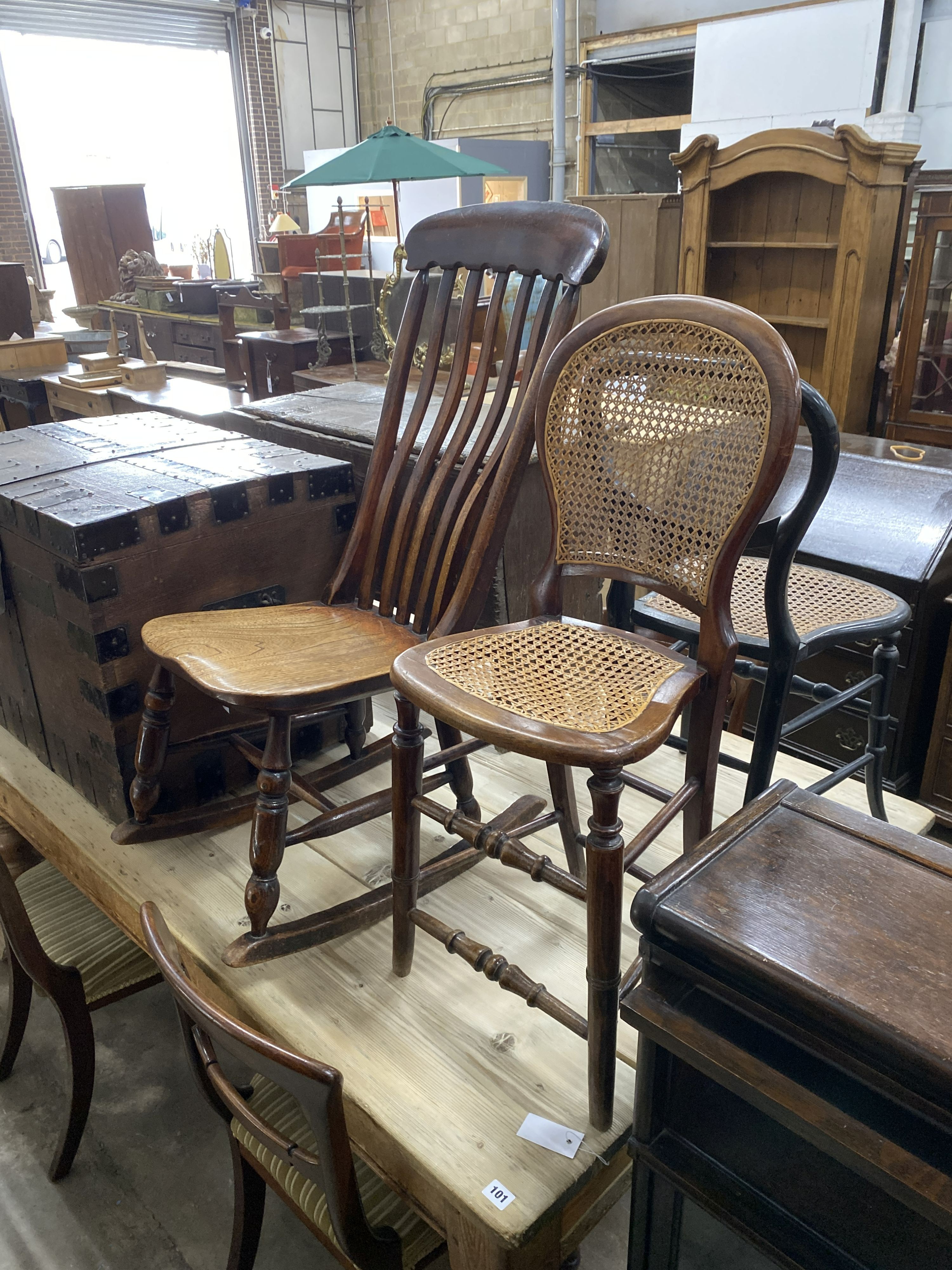 A Victorian elm and beech rocking chair together with two Victorian caned seat chairs